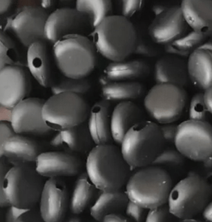 Black silicone beads used as buckles to create adjustable fitting elastic for face masks